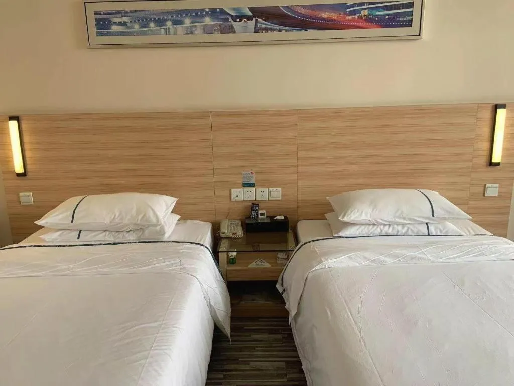 Bed in City Comfort Inn Yichang Wanda Plaza Yunhe Park