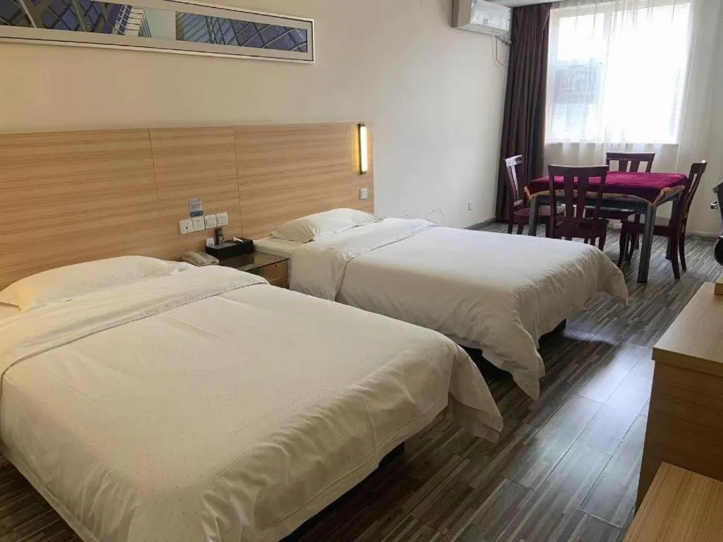 Bed in City Comfort Inn Yichang Wanda Plaza Yunhe Park