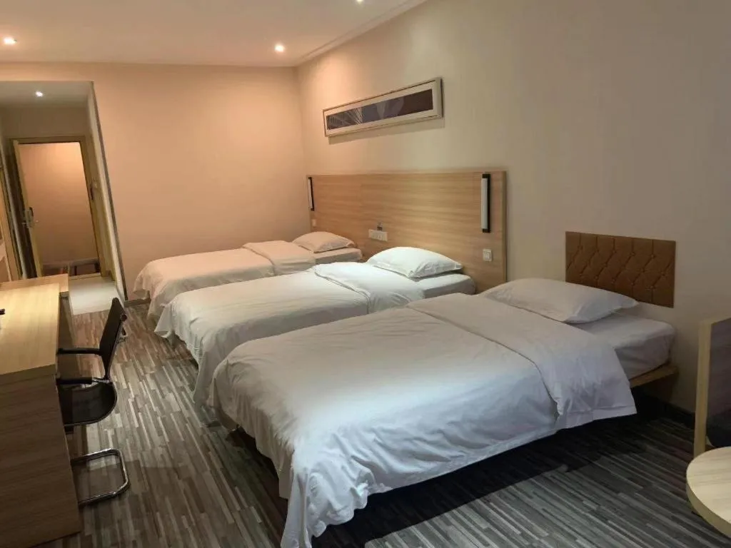 Bed in City Comfort Inn Yichang Wanda Plaza Yunhe Park
