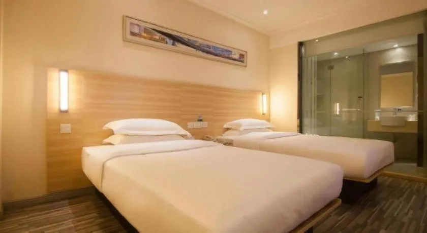 Bed in City Comfort Inn Yichang Wanda Plaza Yunhe Park