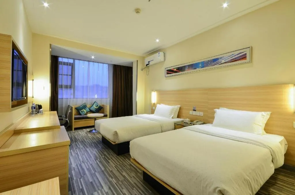 Bed in City Comfort Inn Yichang Wanda Plaza Yunhe Park