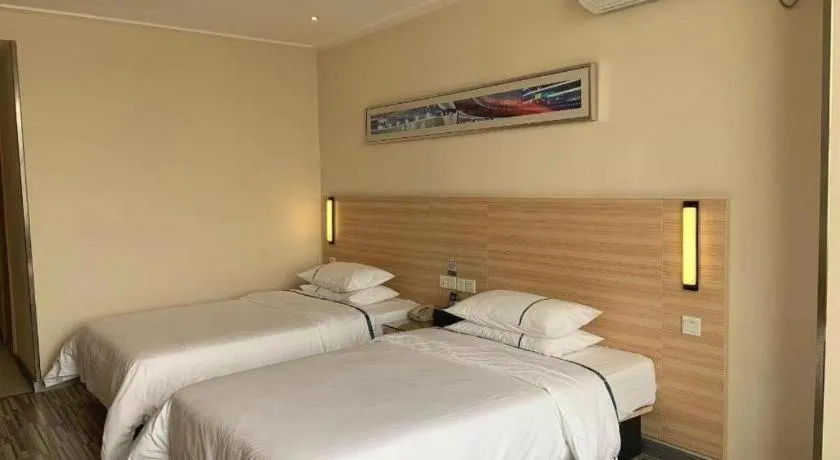Bed in City Comfort Inn Yichang Wanda Plaza Yunhe Park