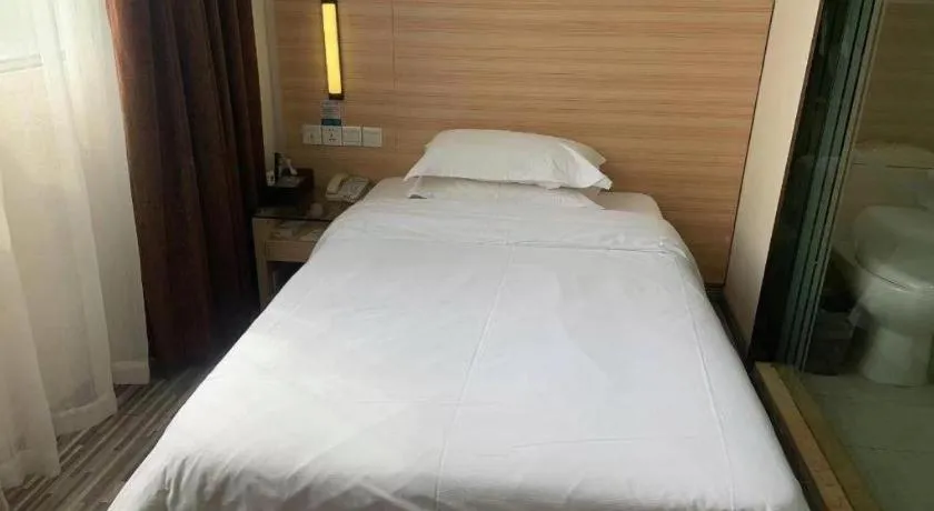 Bed in City Comfort Inn Yichang Wanda Plaza Yunhe Park