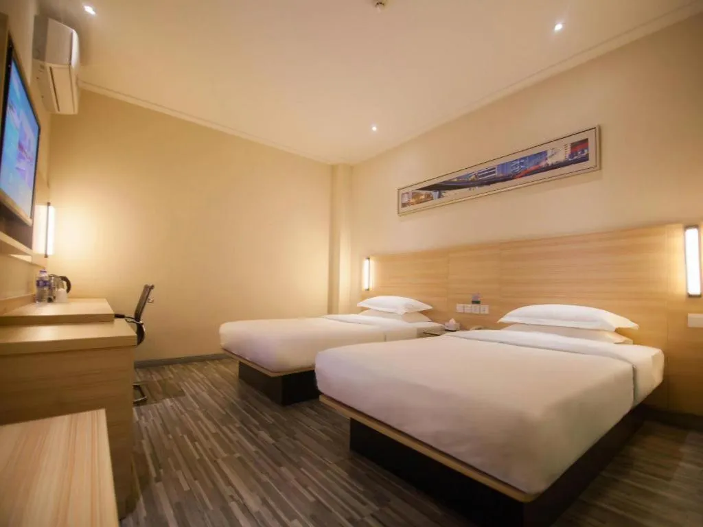 Bed in City Comfort Inn Yichang Wanda Plaza Yunhe Park