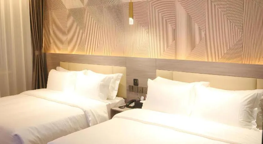 Bed in Borrman Hotel Pingyi Beifang Shicaicheng Mingde Road