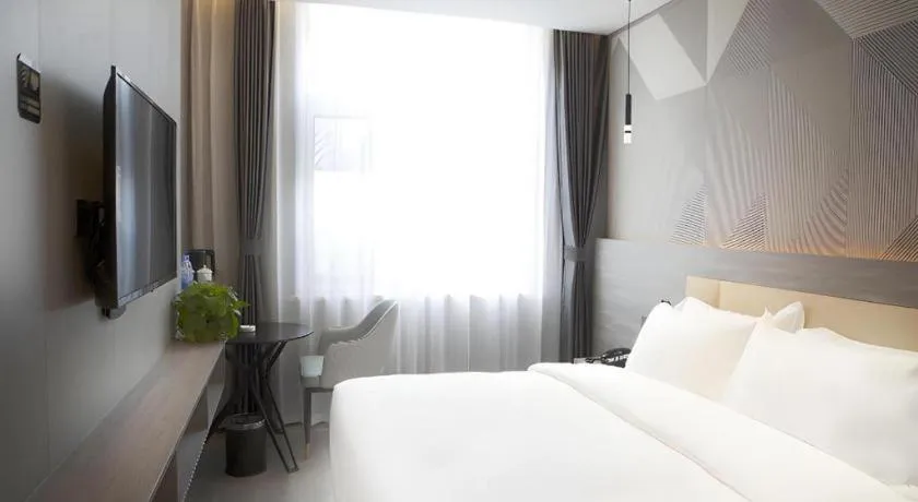 Bed in Borrman Hotel Pingyi Beifang Shicaicheng Mingde Road