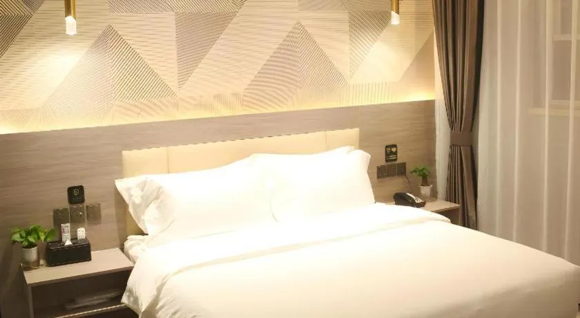 Bed in Borrman Hotel Pingyi Beifang Shicaicheng Mingde Road