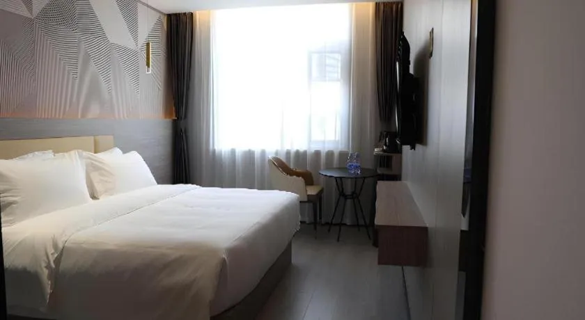 Bed in Borrman Hotel Pingyi Beifang Shicaicheng Mingde Road