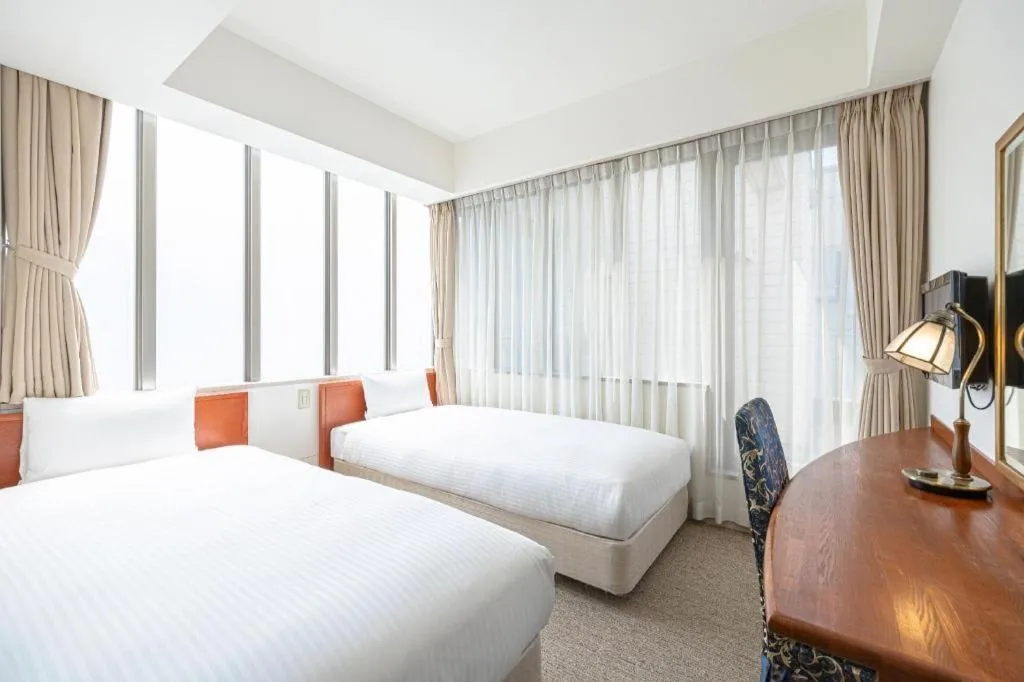 Bed in Ginza Bellevue Hotel