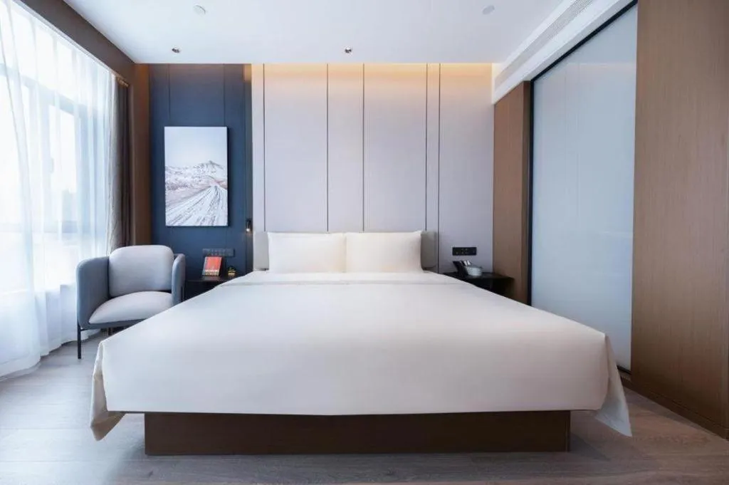 Bed in Atour Hotel Jinan Tangyan Century Avenue