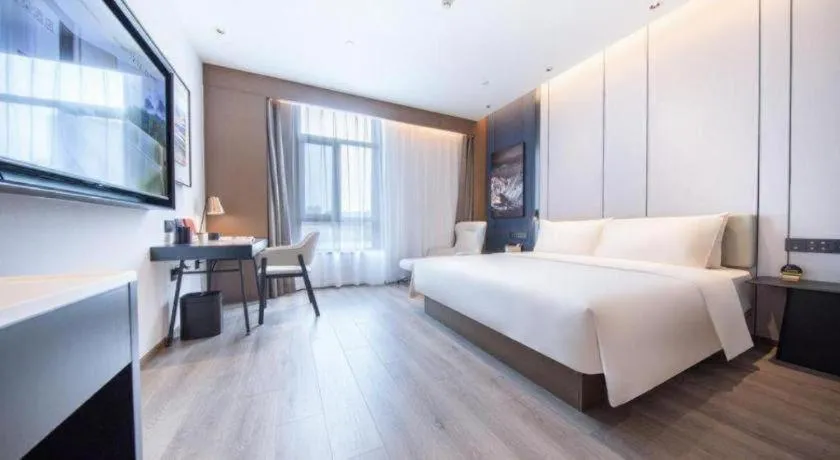 Bed in Atour Hotel Jinan Tangyan Century Avenue