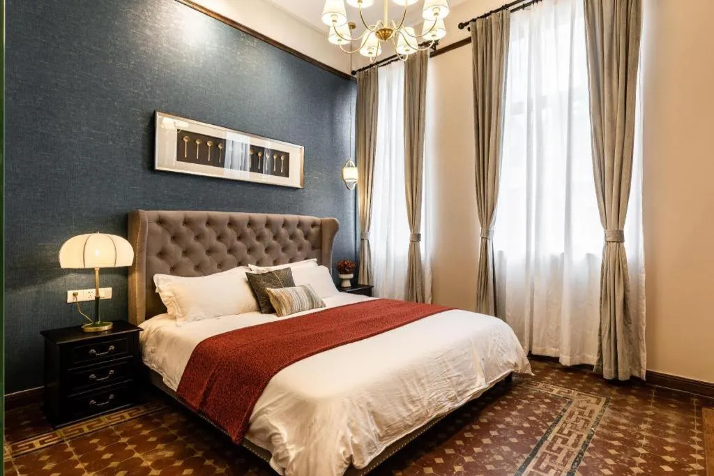 Bed in Origin Antique House and Hotel