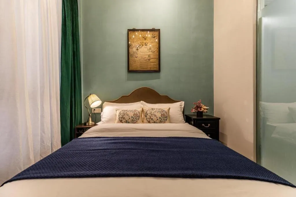 Bed in Origin Antique House and Hotel