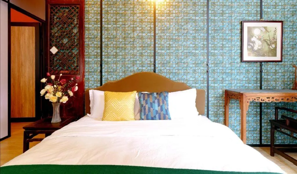 Bed in Origin Antique House and Hotel