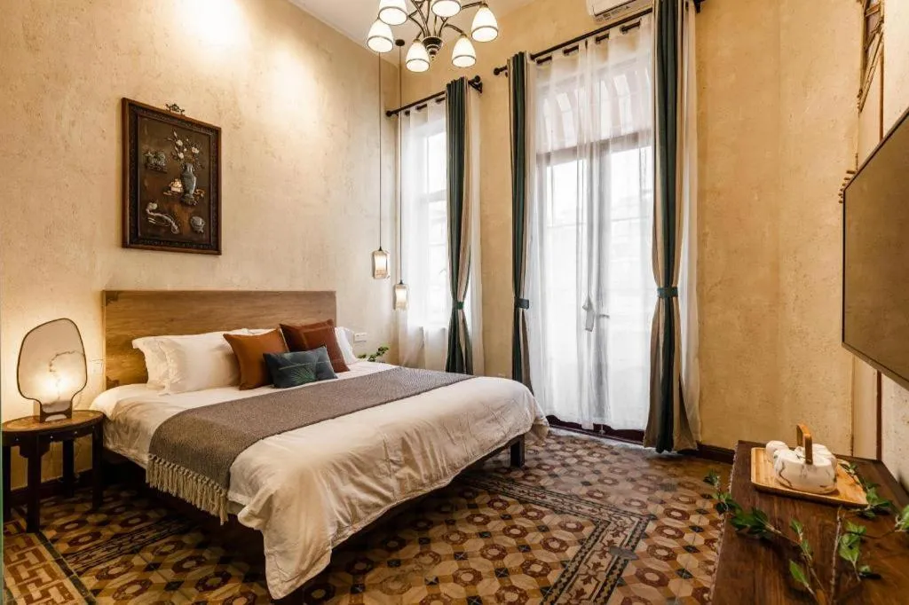 Bed in Origin Antique House and Hotel