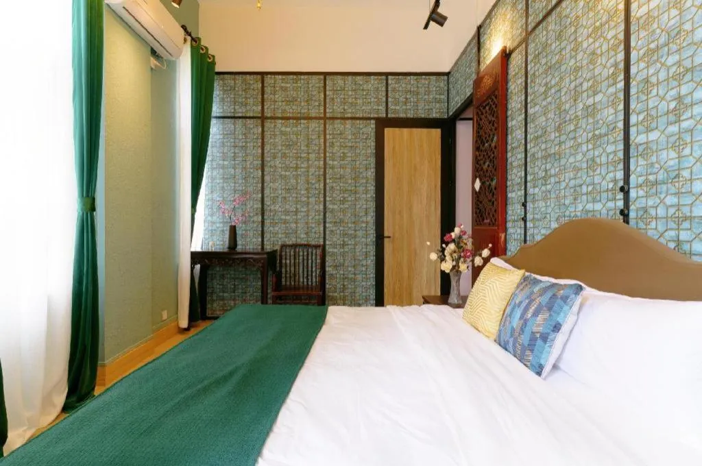 Bed in Origin Antique House and Hotel