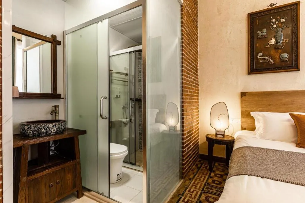 Bed in Origin Antique House and Hotel