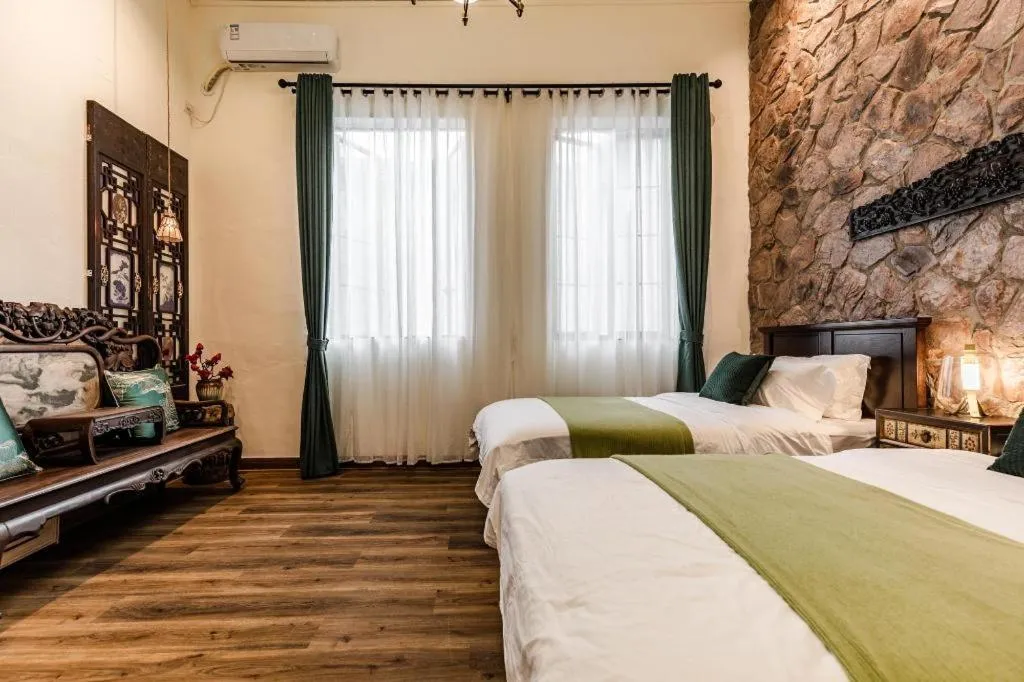 Bed in Origin Antique House and Hotel