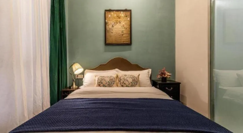 Bed in Origin Antique House and Hotel