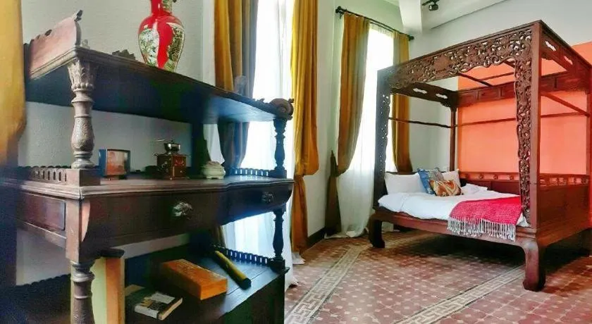 Bed in Origin Antique House and Hotel