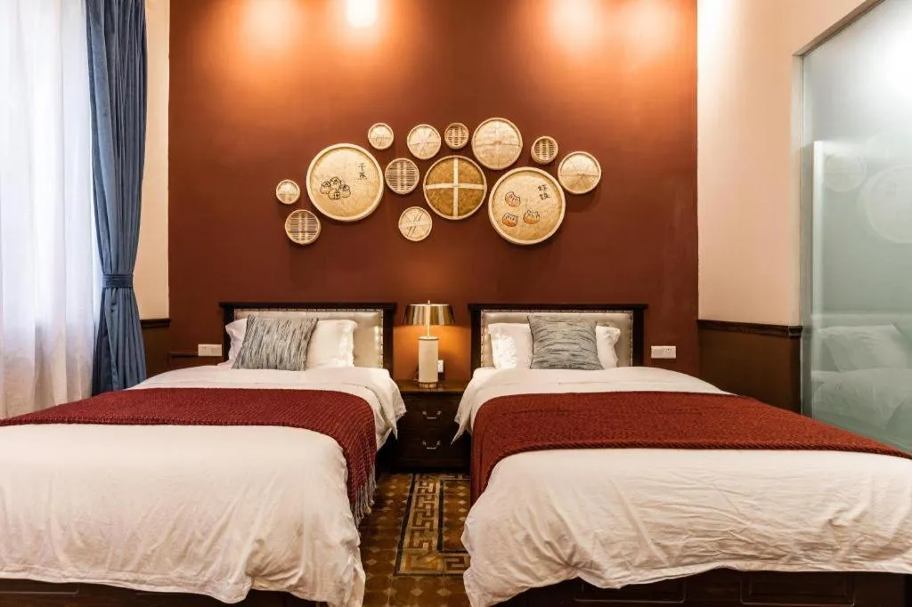 Bed in Origin Antique House and Hotel