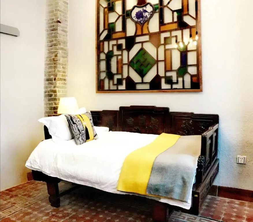 Bed in Origin Antique House and Hotel