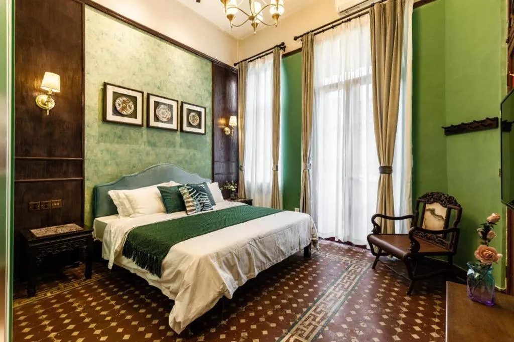 Bed in Origin Antique House and Hotel