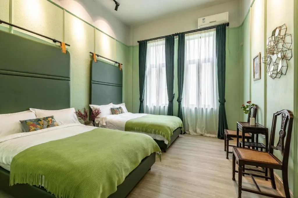 Bed in Origin Antique House and Hotel