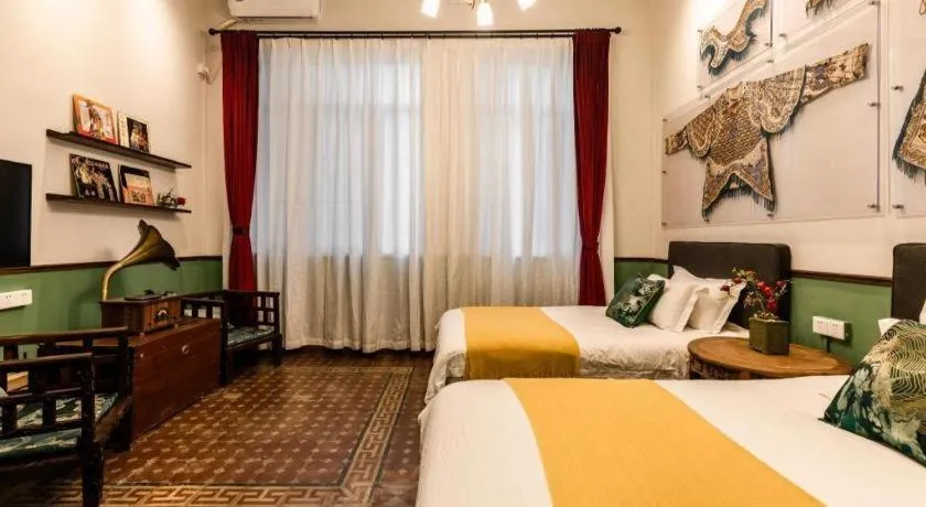 Bed in Origin Antique House and Hotel