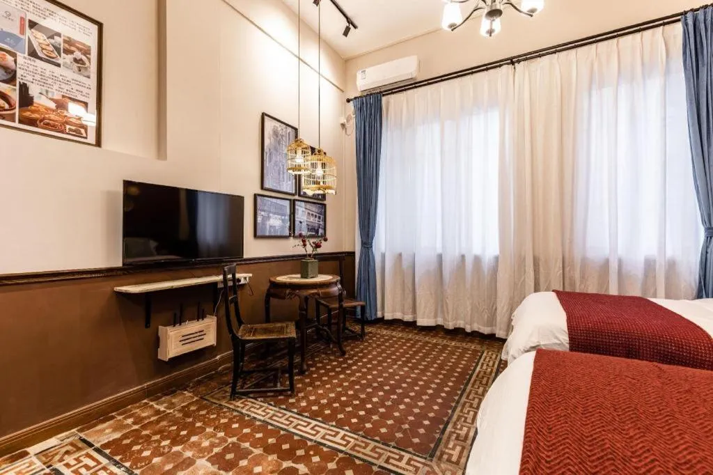 Bed in Origin Antique House and Hotel