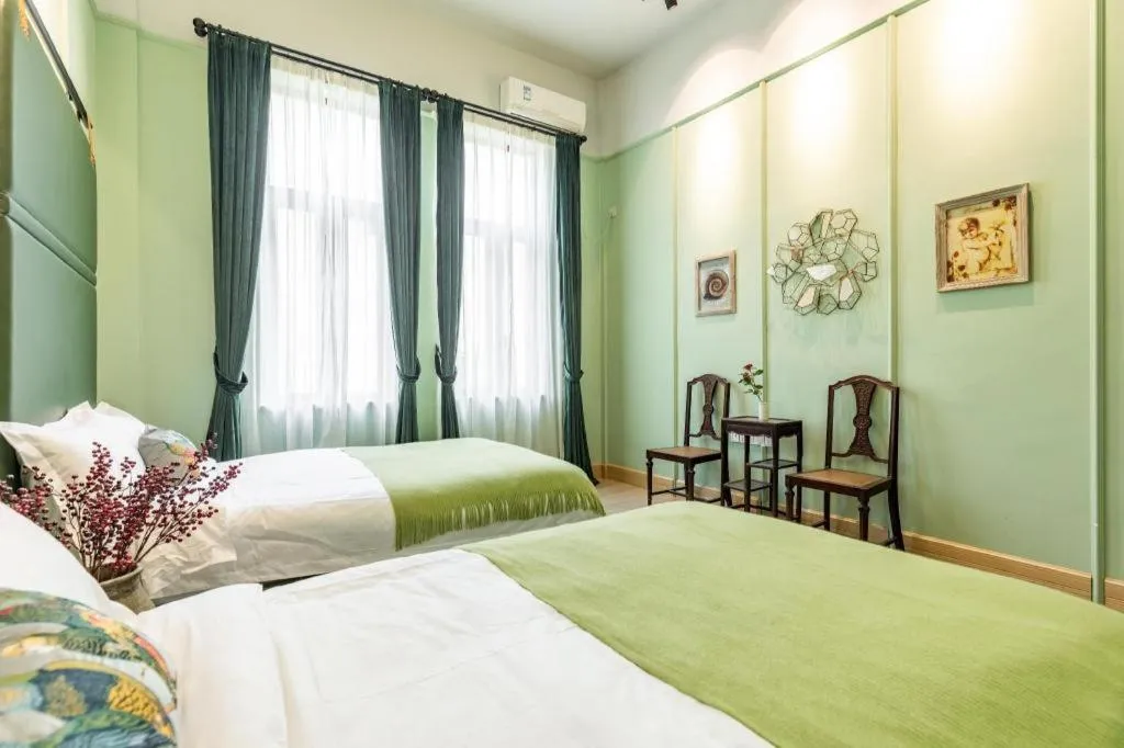 Bed in Origin Antique House and Hotel