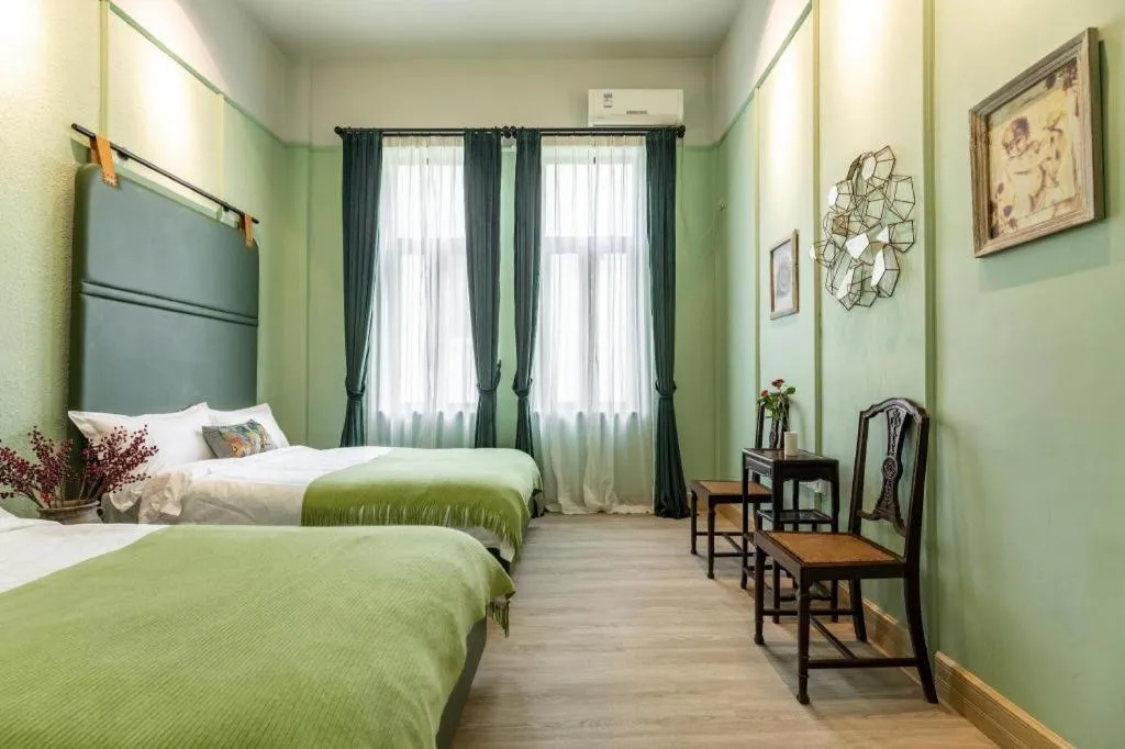 Bed in Origin Antique House and Hotel