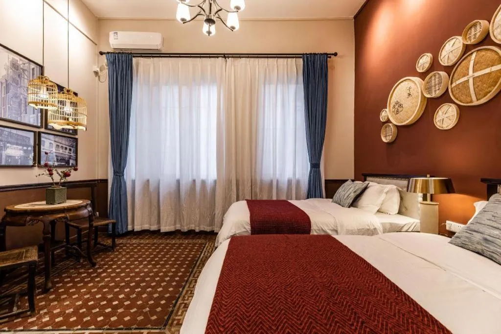 Bed in Origin Antique House and Hotel