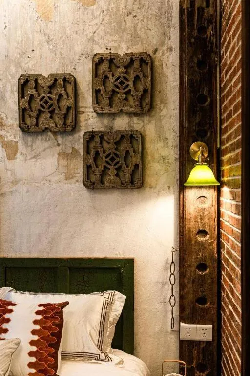 Bed in Origin Antique House and Hotel