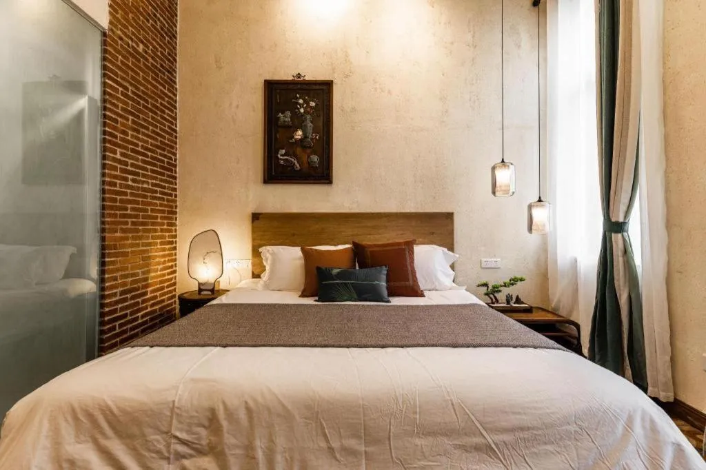 Bed in Origin Antique House and Hotel