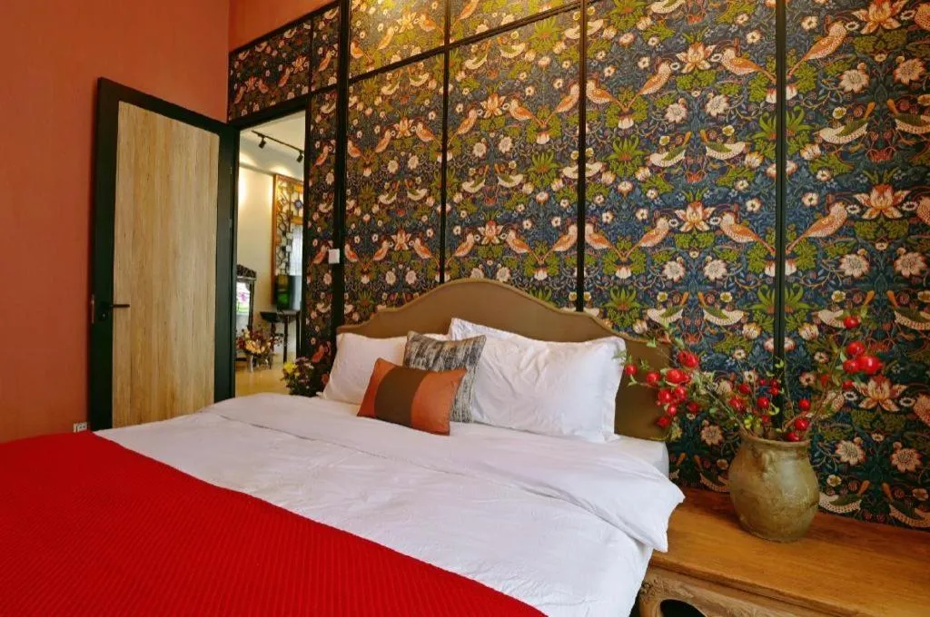 Bed in Origin Antique House and Hotel