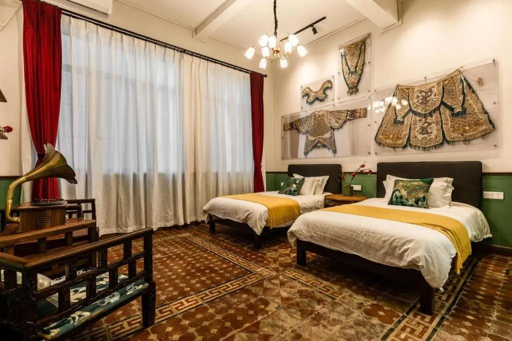 Bed in Origin Antique House and Hotel