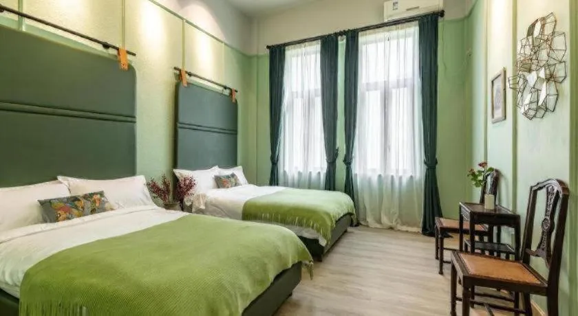 Bed in Origin Antique House and Hotel