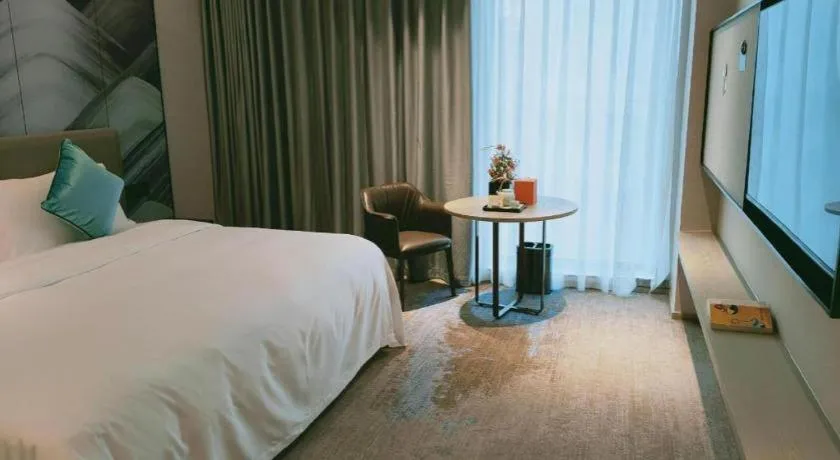 Bed in Yinhu Junyi Hotel（Wildlife Park）