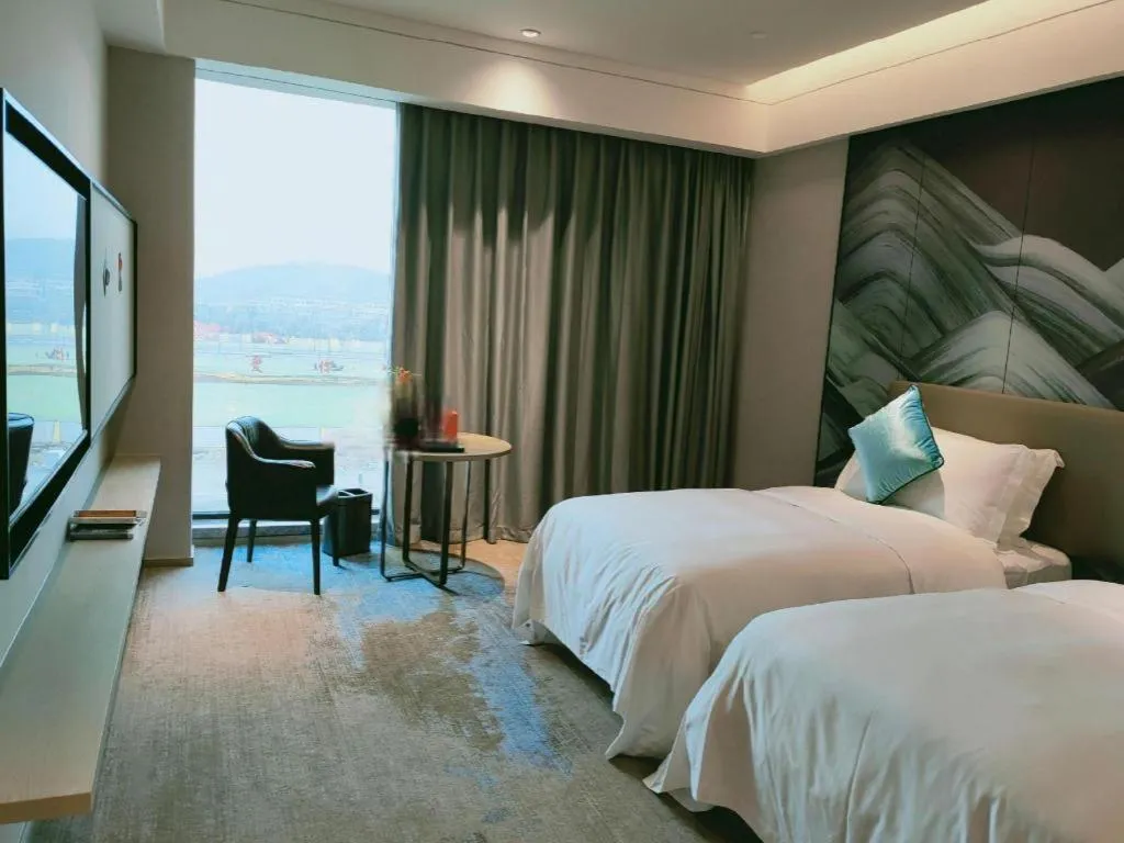 Bed in Yinhu Junyi Hotel（Wildlife Park）