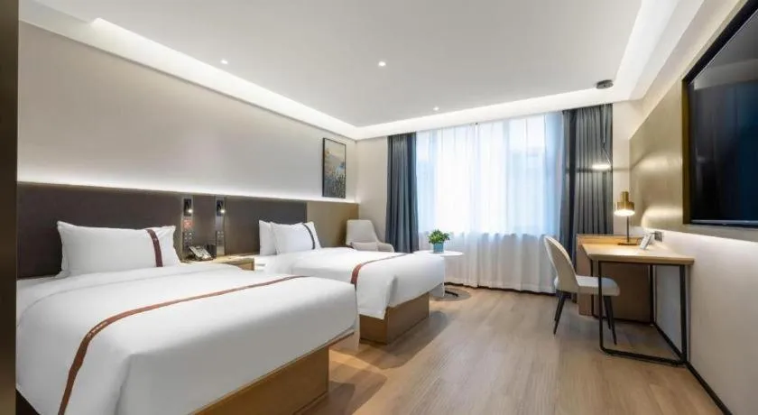 Bed in GYA Hotel Taiyuan Jinyang Street Grand Shanxi Hospital