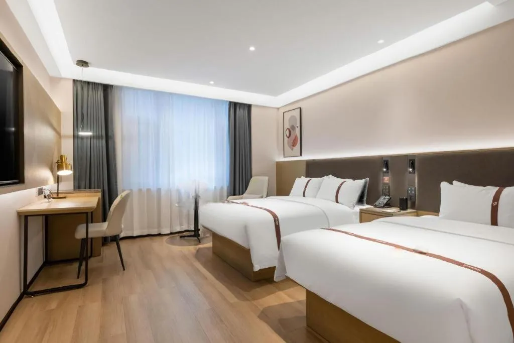 Bed in GYA Hotel Taiyuan Jinyang Street Grand Shanxi Hospital