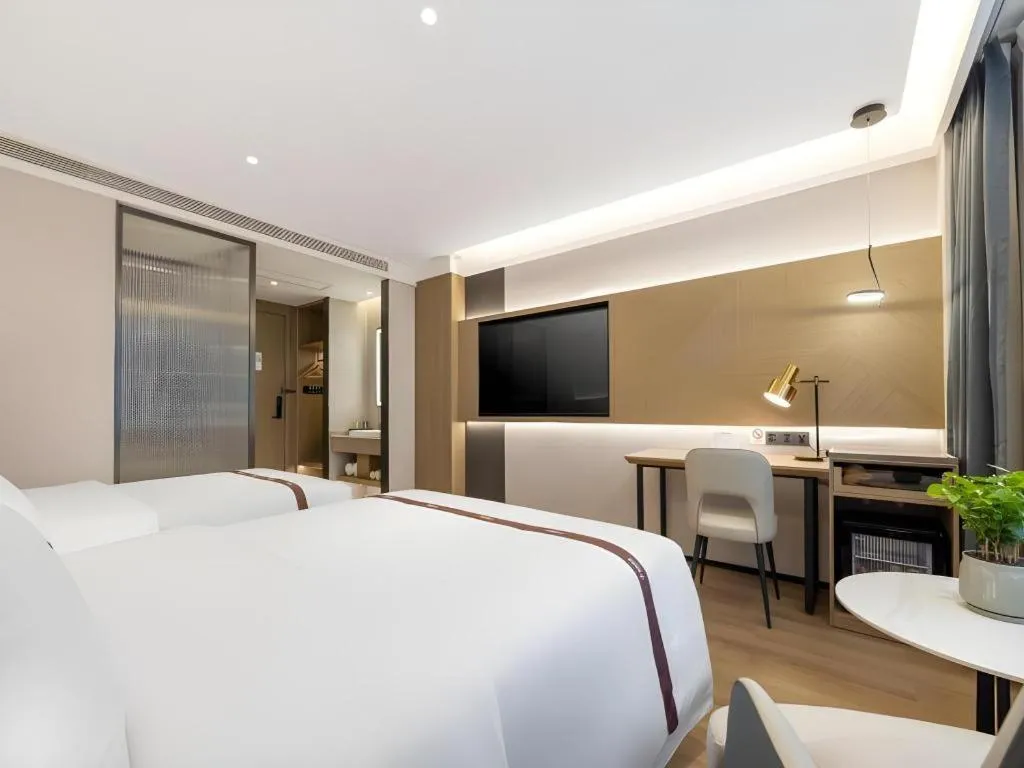 Bed in GYA Hotel Taiyuan Jinyang Street Grand Shanxi Hospital