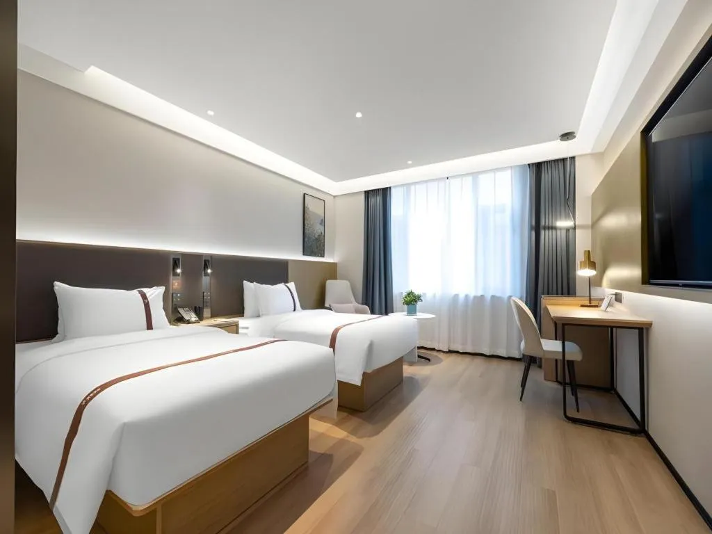 Bed in GYA Hotel Taiyuan Jinyang Street Grand Shanxi Hospital