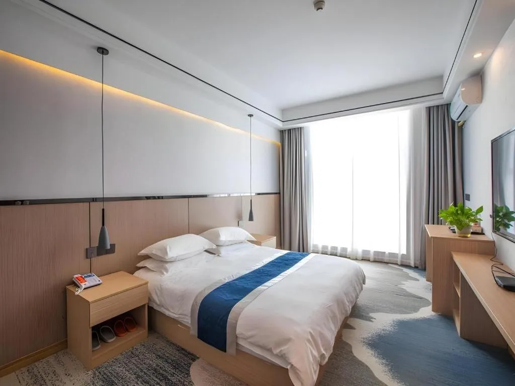 Bed in GELI Hotel Huainan Railway Station Sports Center