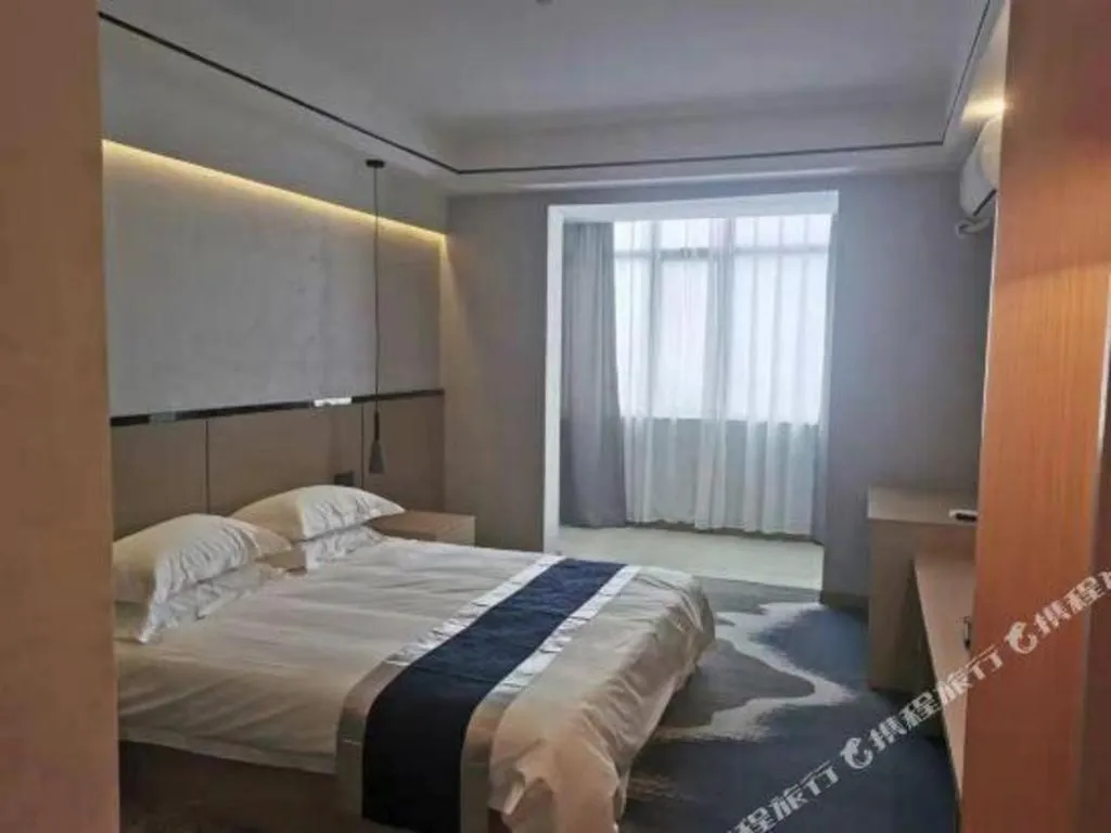 Bed in GELI Hotel Huainan Railway Station Sports Center