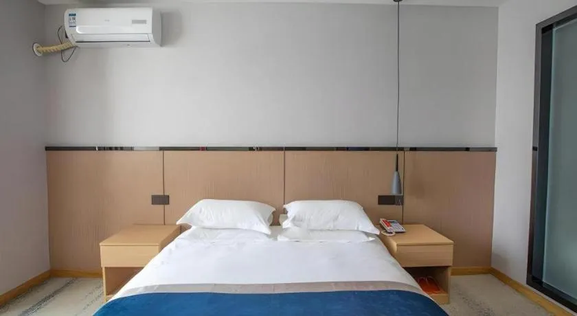 Bed in GELI Hotel Huainan Railway Station Sports Center