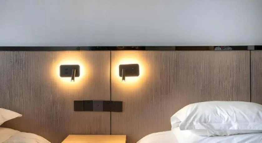 Bed in GELI Hotel Huainan Railway Station Sports Center