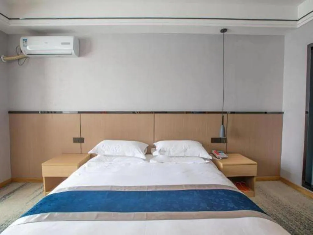 Bed in GELI Hotel Huainan Railway Station Sports Center