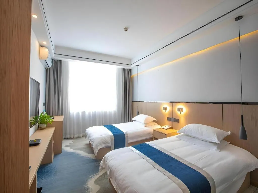 Bed in GELI Hotel Huainan Railway Station Sports Center